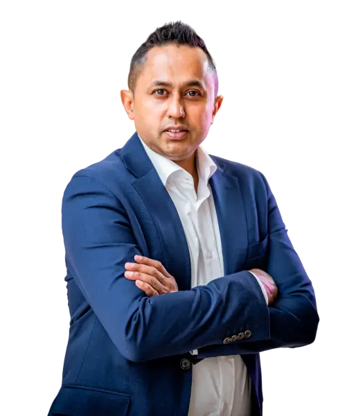 Hemi Hossain in a navy suit, arms crossed